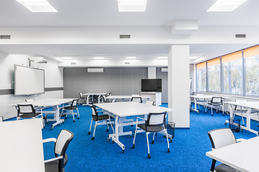 Orange roller blinds in a classroom